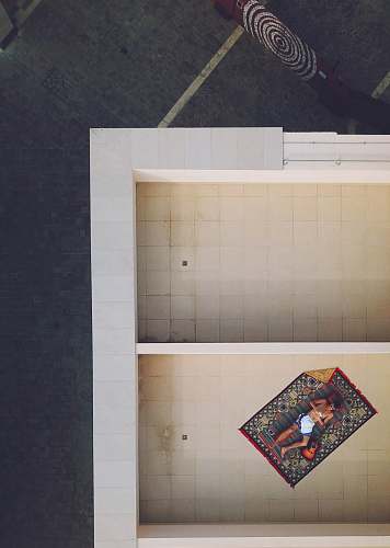 saudi arabia bird's eye view of person resting on rug blanket